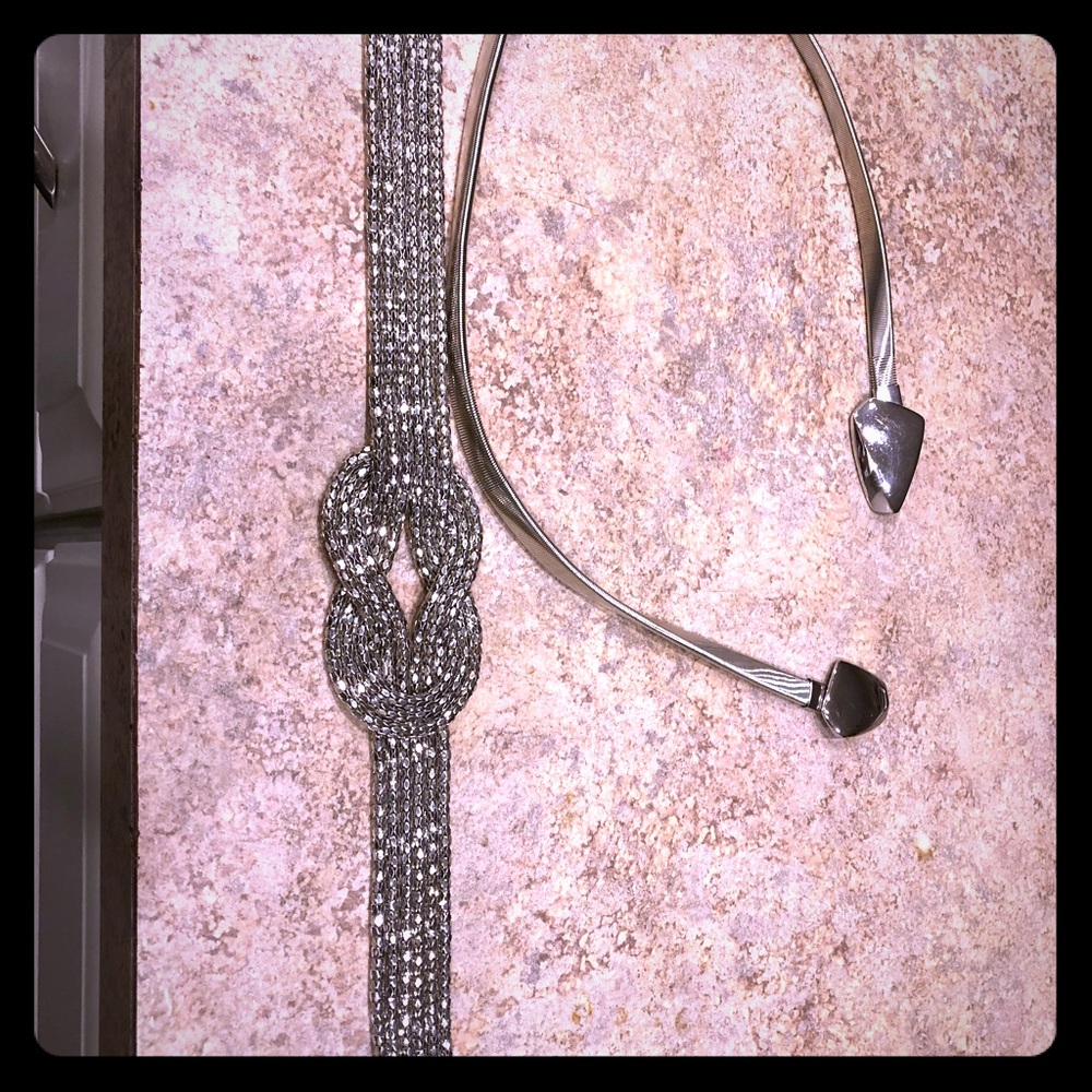 Two silver belts